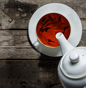 Anverally Tea being poured into a Teacup.